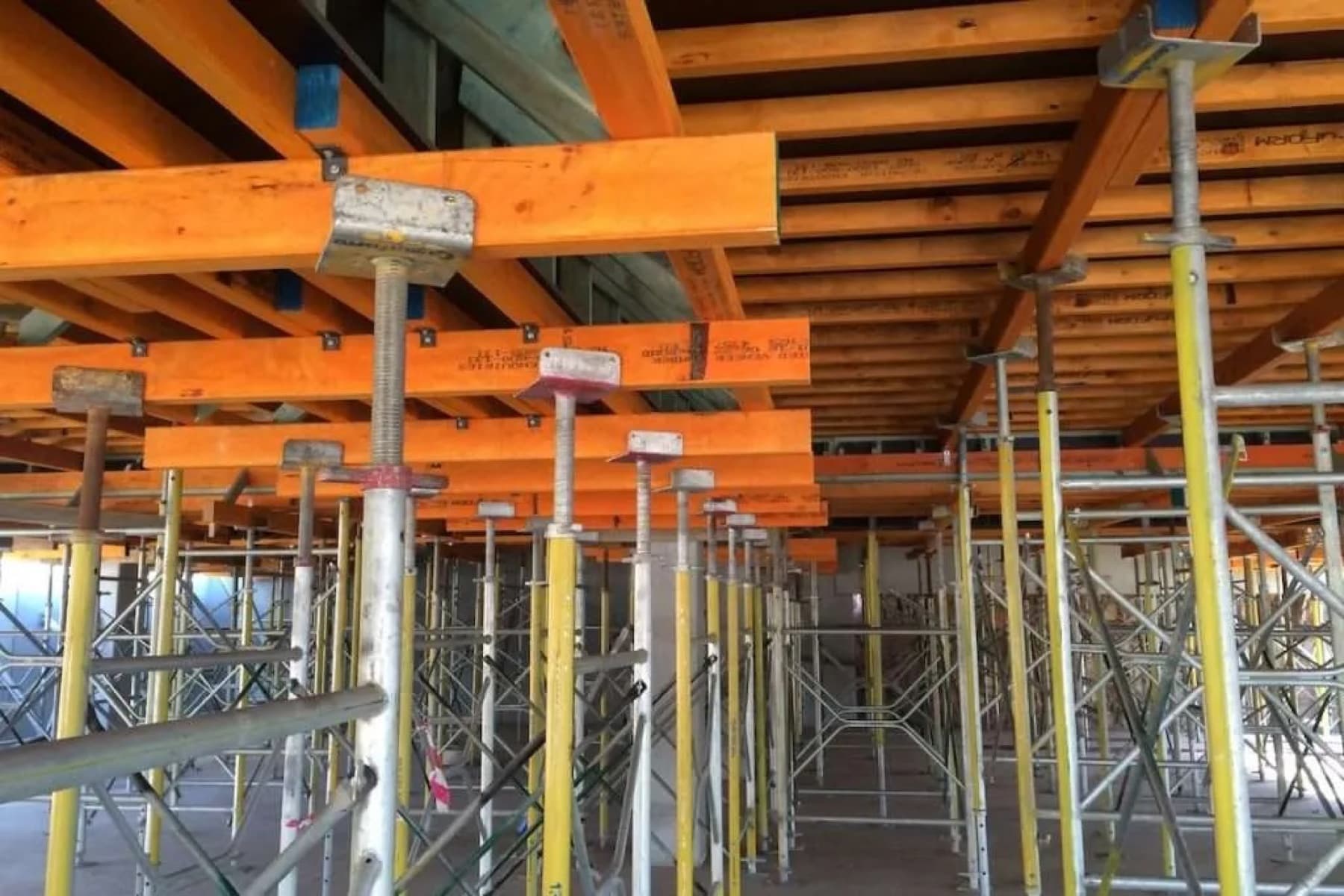 Timber bearers, joists and steel props supporting a suspended slab formwork deck