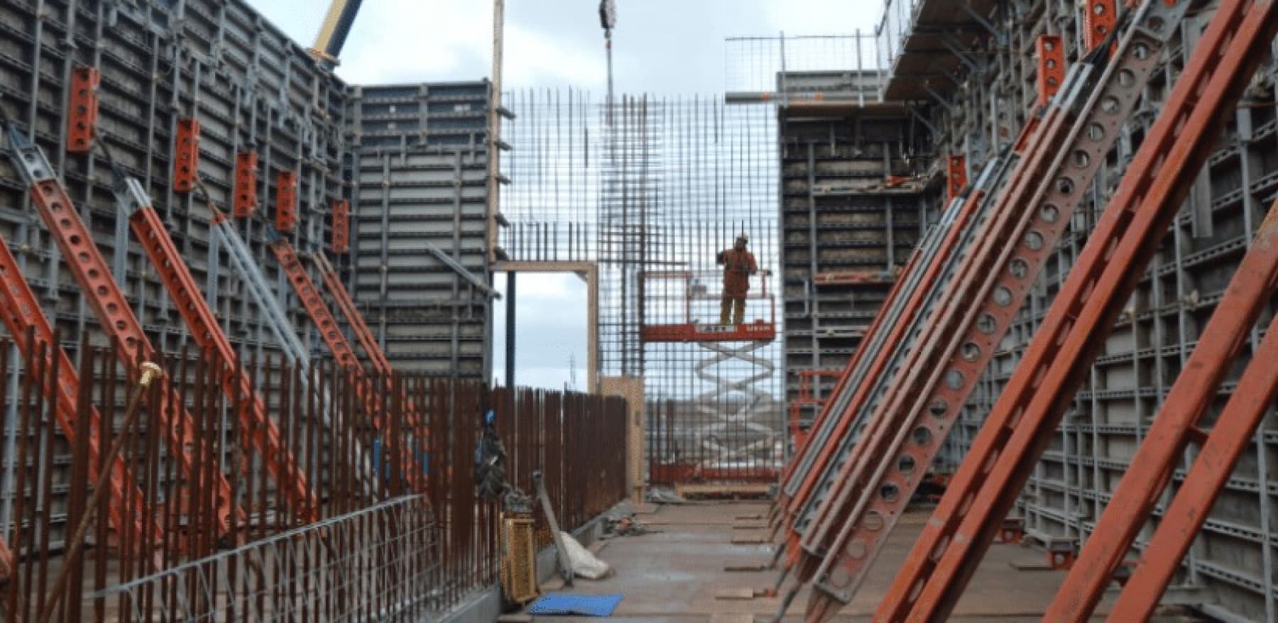 Twin runs of wall formwork forming a bridge substructure